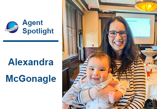 Agent Spotlight, Alexandra, holds her baby while sporting a big smile.