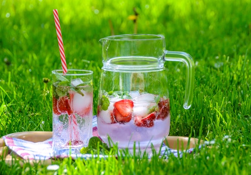 Stay hydrated this summer with a pitcher of refreshing water with strawberries