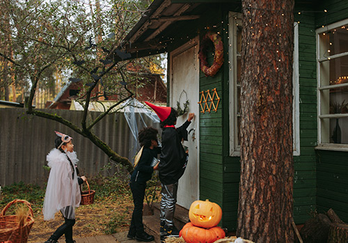 Children go trick-or-treating on Halloween.