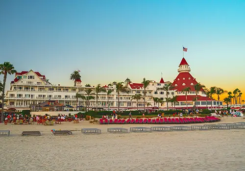 The hotel del Coronado is photographed at sunset.