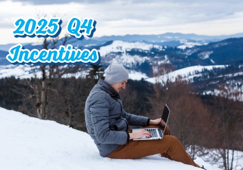 A freelancer working on a laptop on top of the world winter landscape.