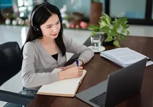 A woman studies online.