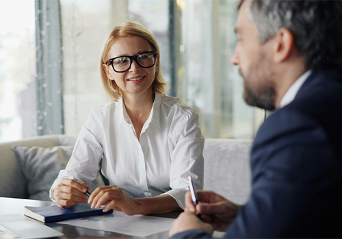 An insurance broker practicing Supercommunication by listening and looping for understanding during a Medicare consultation.