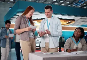 People converse with each other at a job fair.