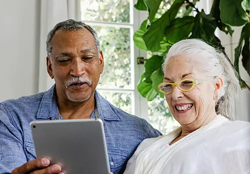 Senior couple reading documents online