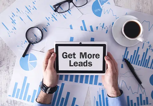Man is holding a sign that says get more leads to health agents see that empower offers free lead programs